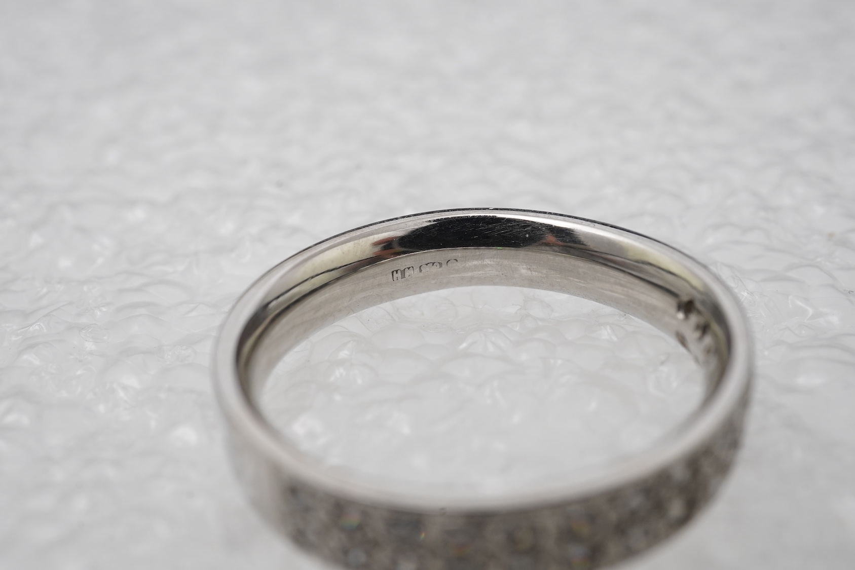 A diamond half eternity ring
